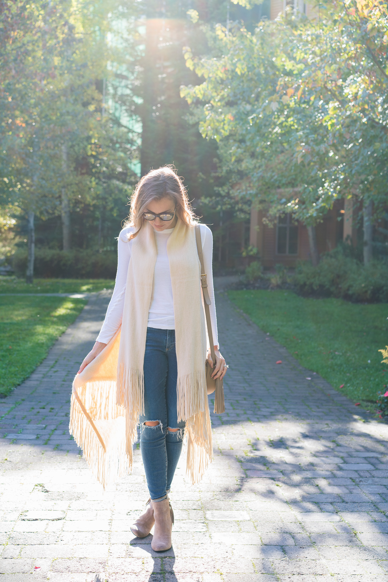 Nordstrom Fall outfit fringe sweater vest white thermal tee distressed ag skinny jeans dolce vita tan booties angela lanter hello gorgeous