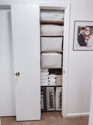 Bathroom closet organization hacks for small linen closet storage solutions by Angela Lanter lifestyle blogger