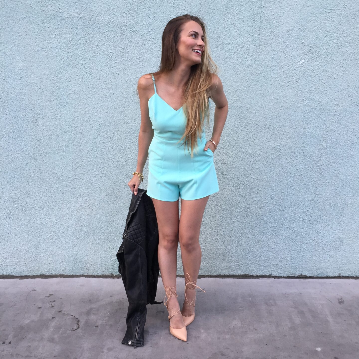 green linen jumpsuit blog post by fashion blogger Angela Lanter wearing mint green romper, lace-up steve madden nude heels, and All Saints black leather jacket