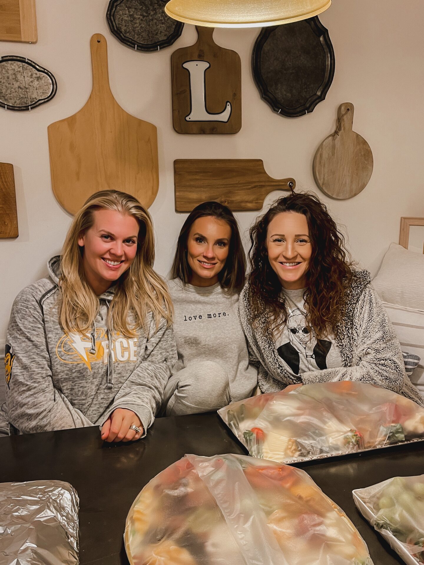 lifestyle blogger Angela Lanter sitting at her kitchen table with her lifelong friends