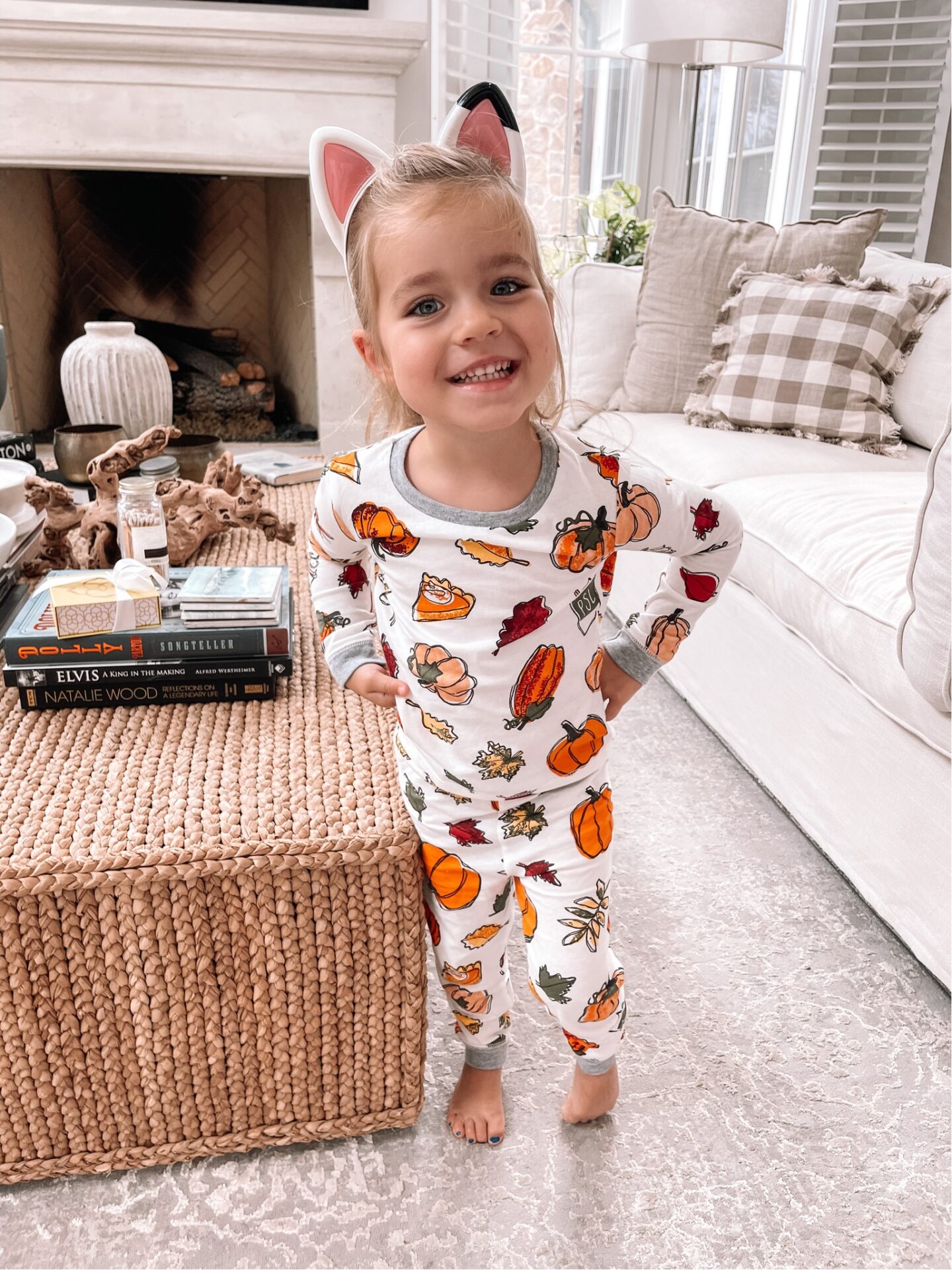 Adult and Kids Halloween Pajamas toddler girl wearing Mud Pie Halloween pajamas by lifestyle blogger Angela Lanter