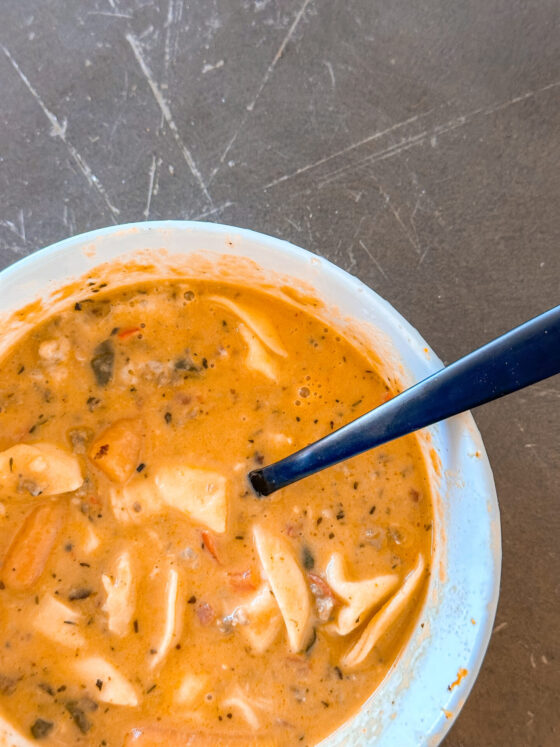 VIRAL Creamy Parmesan Italian Sausage Soup with Tortellini by lifestyle blogger Angela Lanter