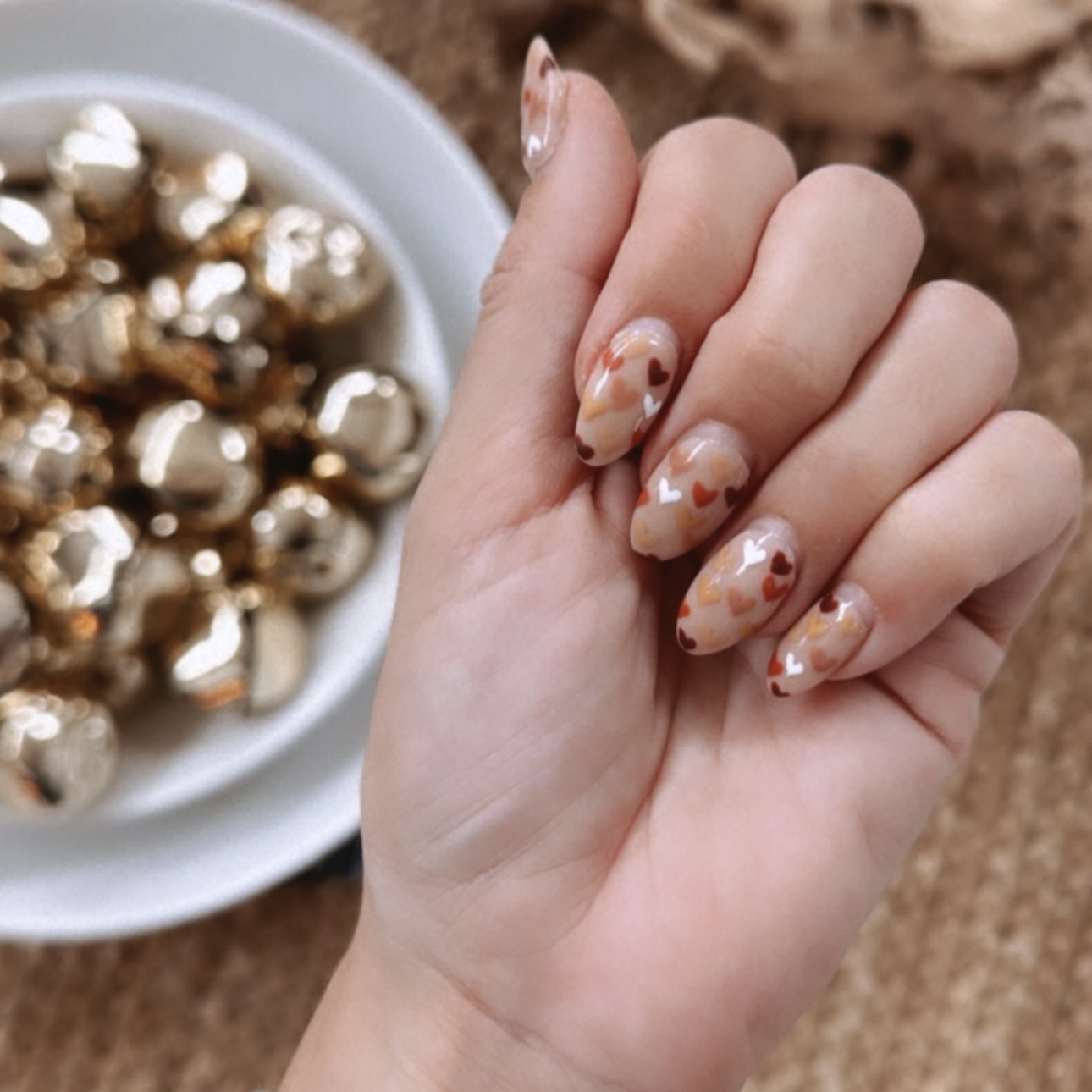 Cute Fall nails. Brown hearts dip powder nails with gel polish by beauty blogger Angela Lanter