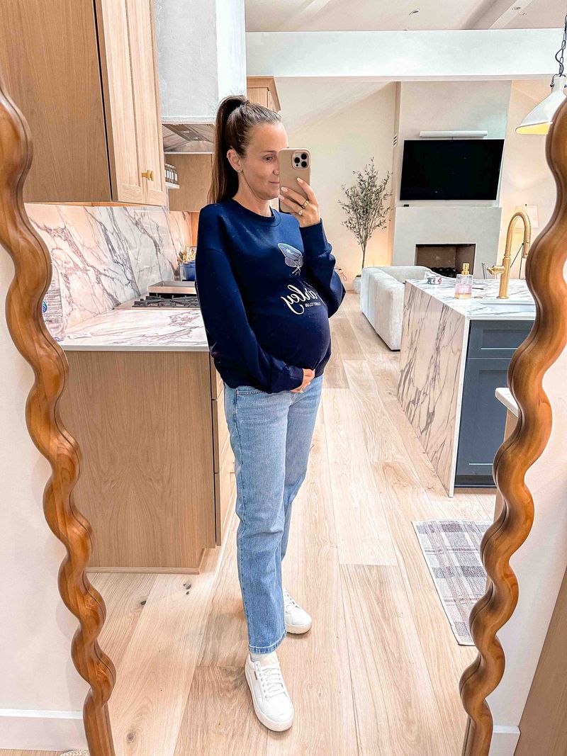 second trimester cute pregnancy outfits by lifestyle blogger angela lanter wearing Varley and Mango Maternity Jeans