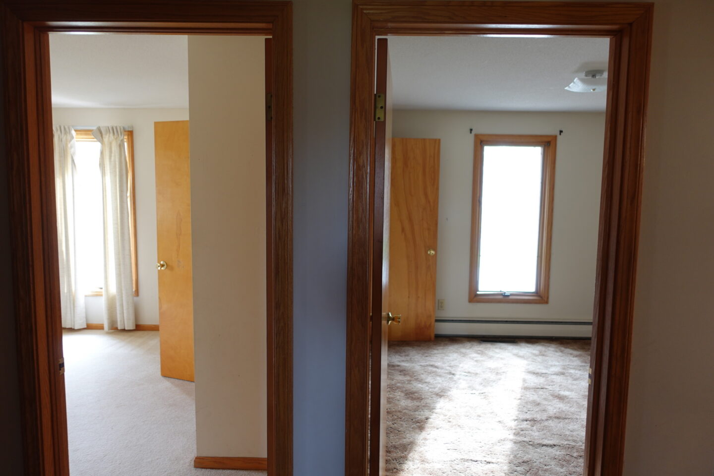 view through two doorways before Ohio house bedroom makeover